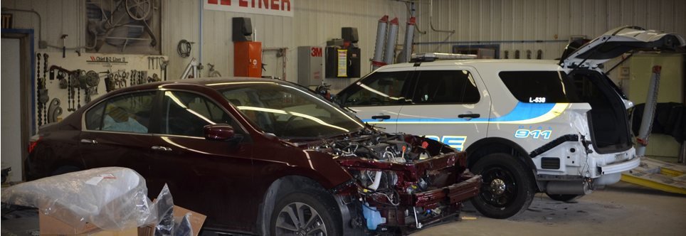 Cars in the By-Pass collision repair bays
