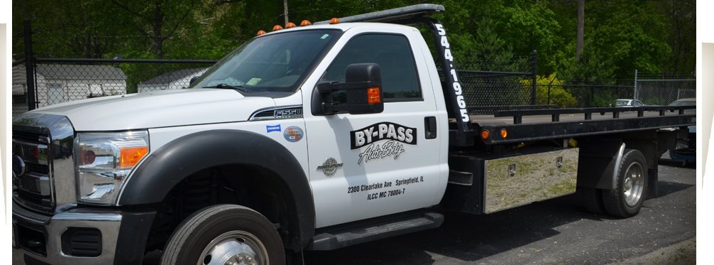 The By-Pass Auto Body flatbed tow truck
